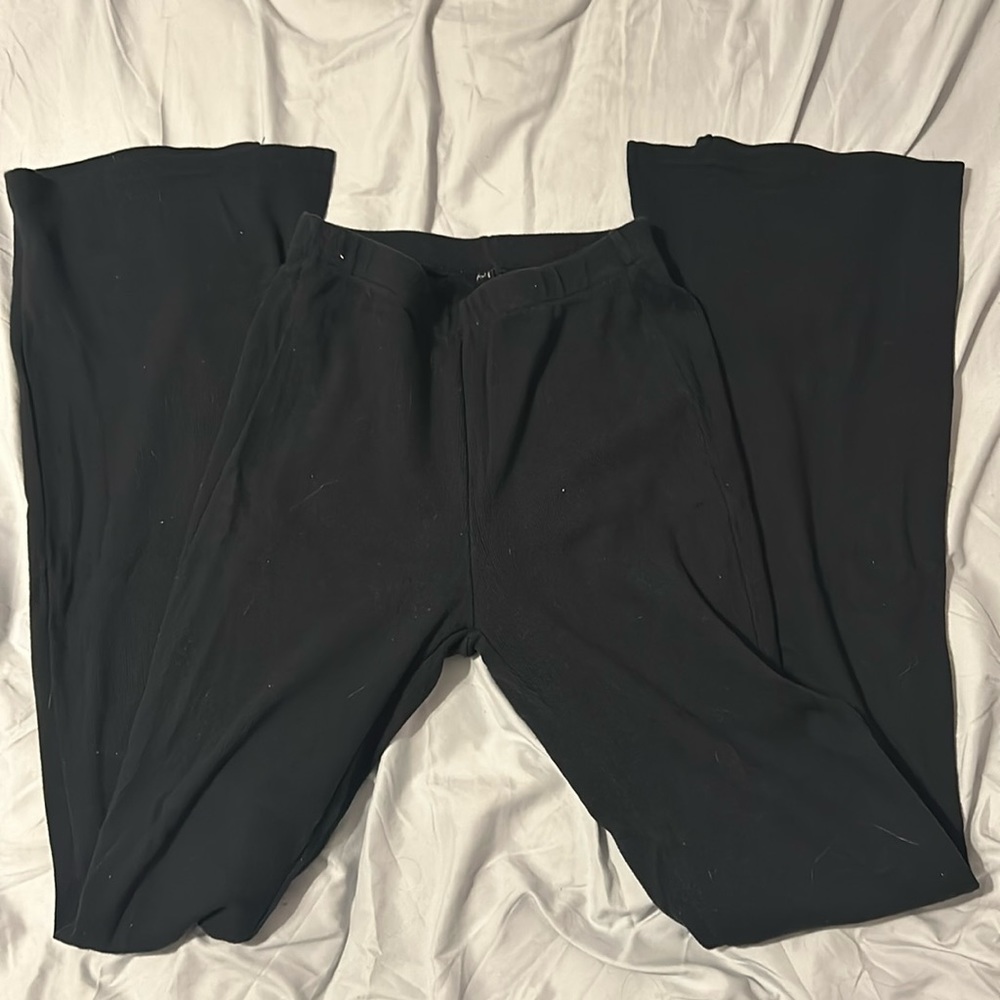 Black flared leggings.